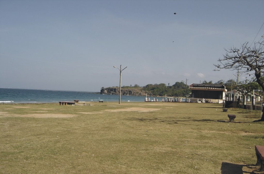 Dutch bay beach and the ground in the noon by Upali Somasiri