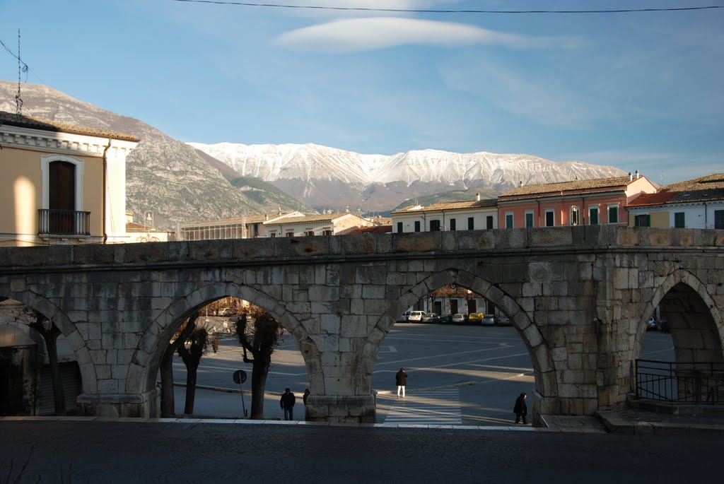 Sulmona, aquaduct with snowy mountains in background by Seimen Burum