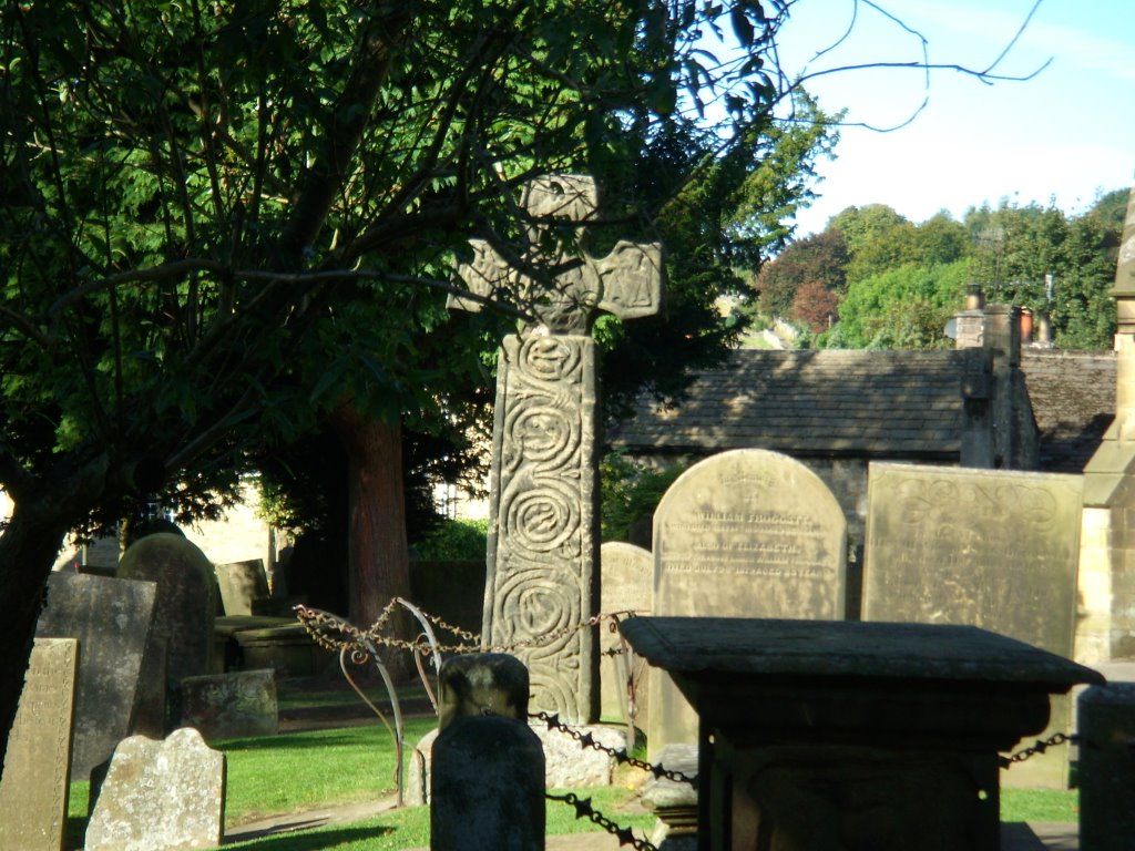 The Celtic cross in Eyam churchyard. by HannibalCat