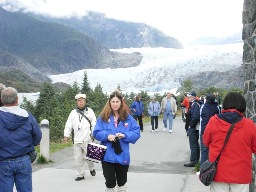 Tourist hiking to Mendenhall Glacier, Juneau AK by seahawk