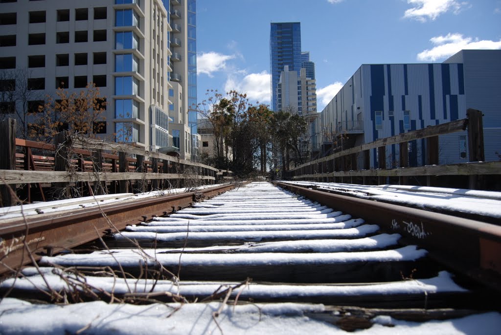 Snow tracks to nowhere by Erik Norwood