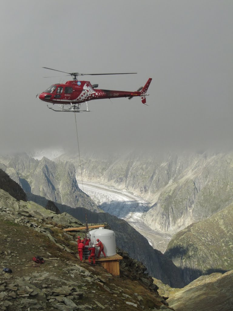 Switzerland, White and red, Men at Work in Fiescherthal nearby the glacier by ad vitam et terrae n…