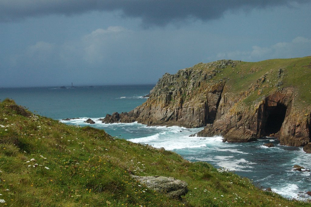 Carn Barra with Longships lighthouse in the distance. by Row 17