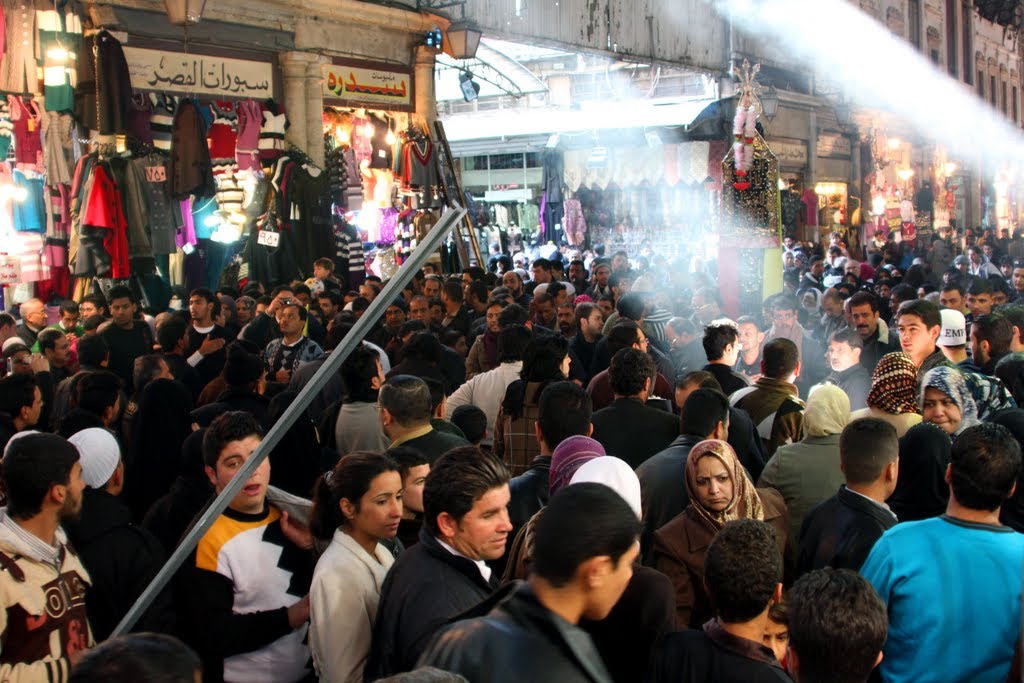 Crowds heading for the Umayyad Mosque through Souq Al-Hamidiya by rockman