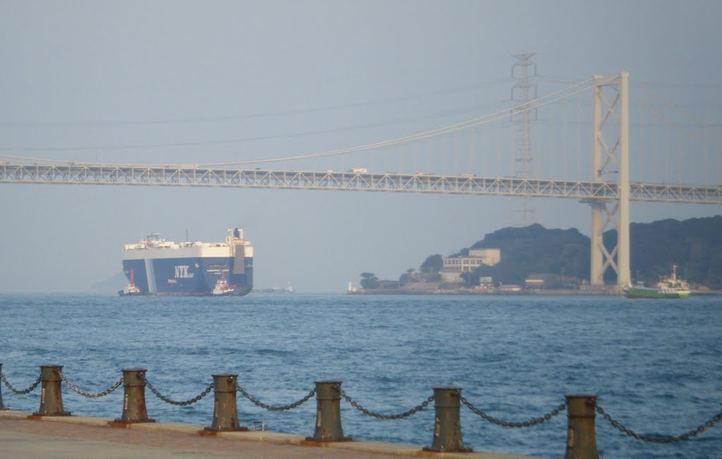 Car carrier passing under bridge by gary4now