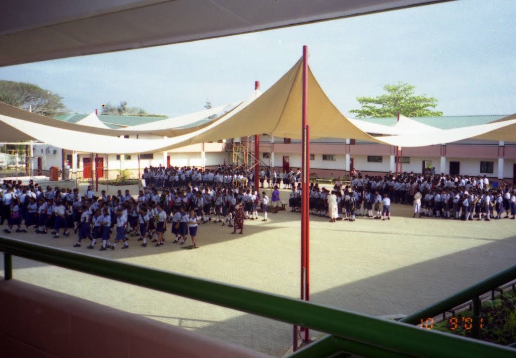 First days at the New POM GRAMMER School, Assembly under the Shade Sails on Brick Paved Court Yard, surrounded by 70 odd Classrooms in Square Shape 2 Story BUILDING Block, in Bava Street in East BOROKO area, Port Moresby, PNG, on 10-09-2001 by Peter John Tate,