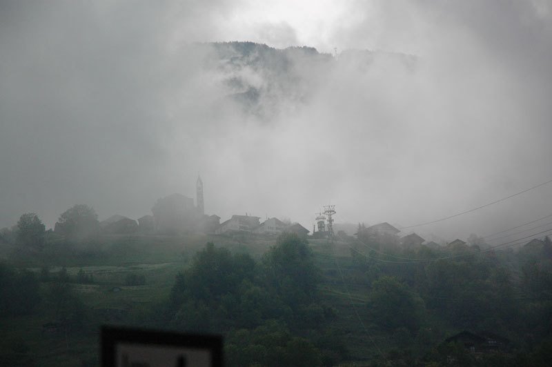 Staldenried village in clouds by ajaxel