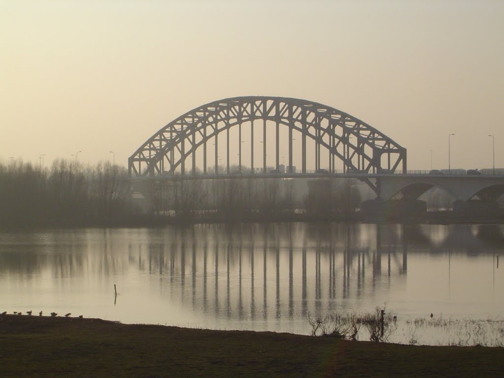 The IJsselbridge in the evening sun by Wim Rietberg