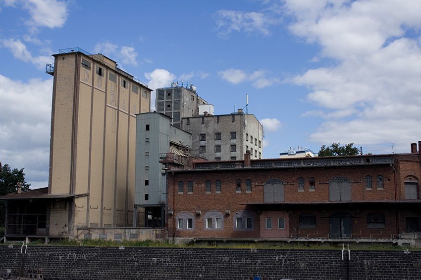 Granary in city harbor by psboy.pl