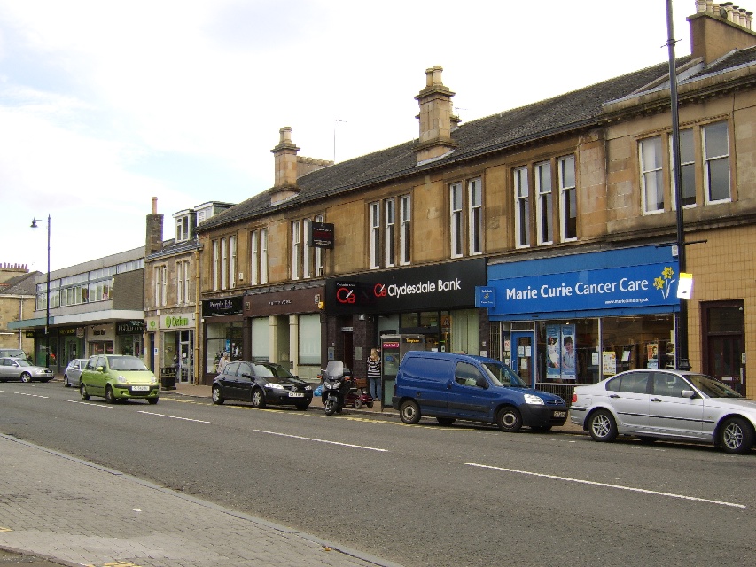 Row of shops near Bearsden Cross by seventiescopshow