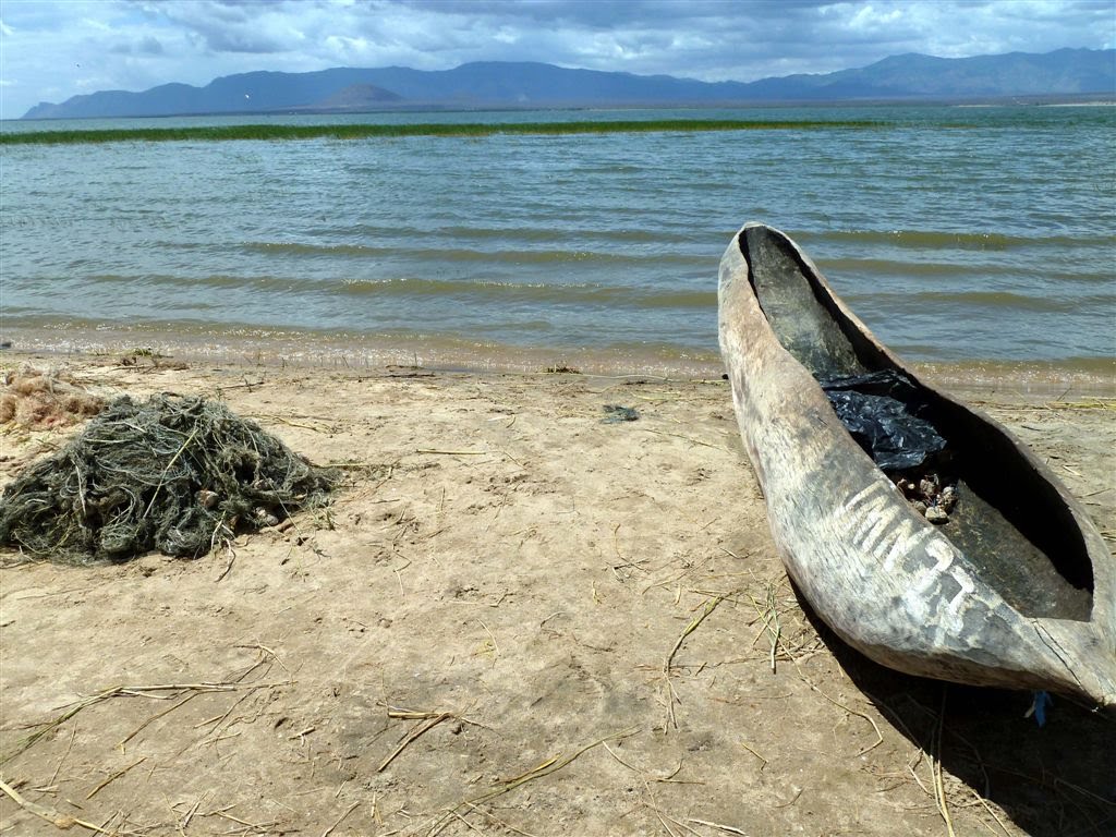 Magadini, View of the Lake Nyumbaya Mungu, Typical Fisherboat in the Front by walterhellmut