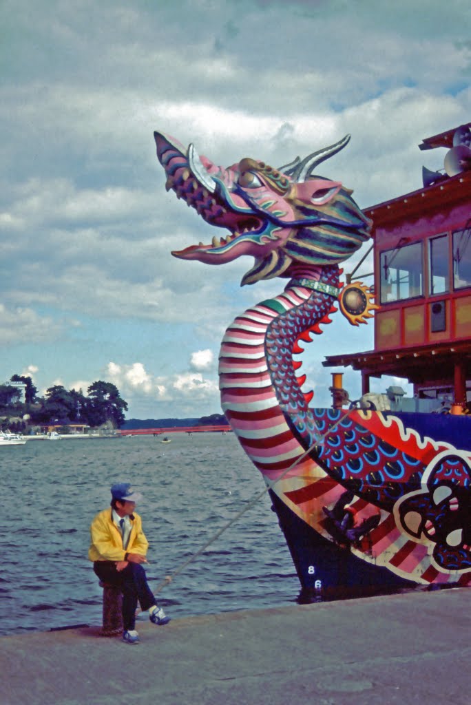 Dragon boat in Matsushima Bay harbor, Miyagi. Fukuurabashi in background - 松島 福浦橋 by Todd Stradford