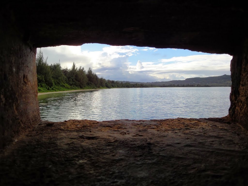 View from inside a Japanese WWII Pillbox on Dadi Beach, Naval Base Guam. The Japanese used this and similar pillboxes dug into the limestone for the defense of the Orote Peninsula, using 37mm, 47mm, and 75mm guns protruding from the openings. by GreeenGuru