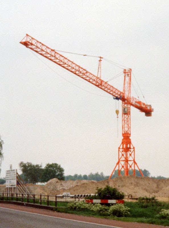 Large tower crane at construction site by M.H.W. Smits