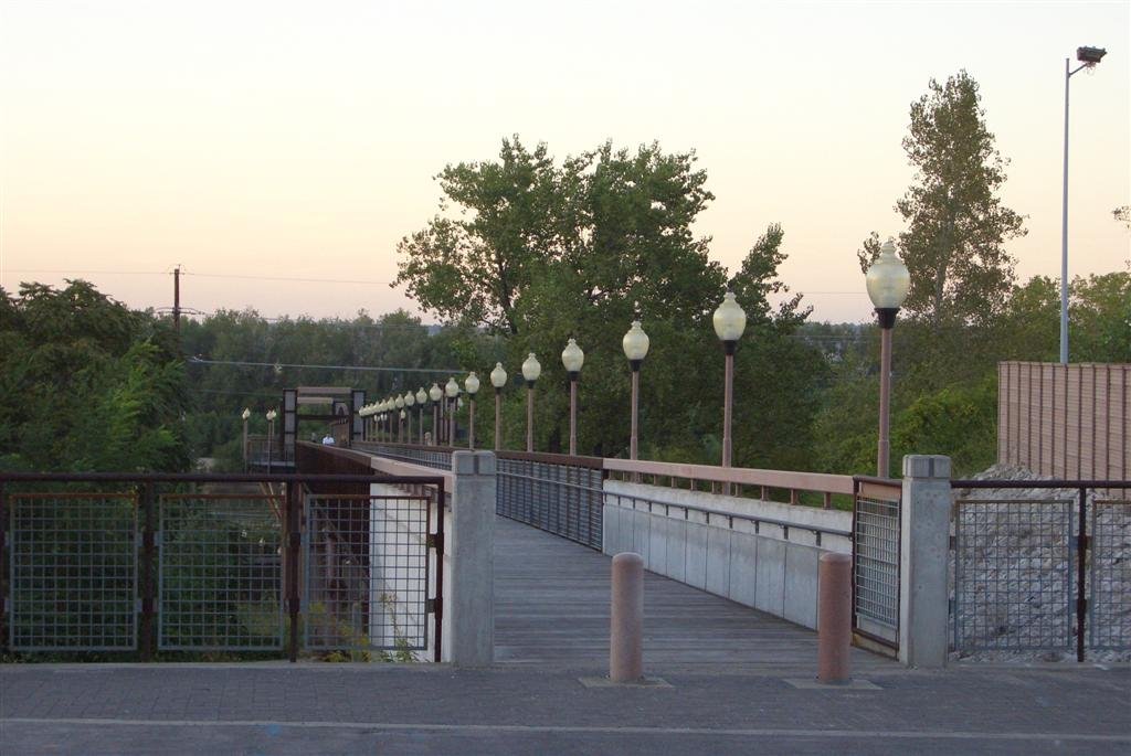 City of Kansas Bridge,A neat surprise! This is the north end of Main street, south of the Missouri River and north of the City Market, it is an elevated pedestrian walkway that goes out to an elevated viewing platform that looks right over the Missouri River, the platform is on the river-side of the levee walls and railroad tracks, you can also use the stairs by the platform to connect to the walking trail at the Berkley River Front Park, Kansas City, MO by marnox1