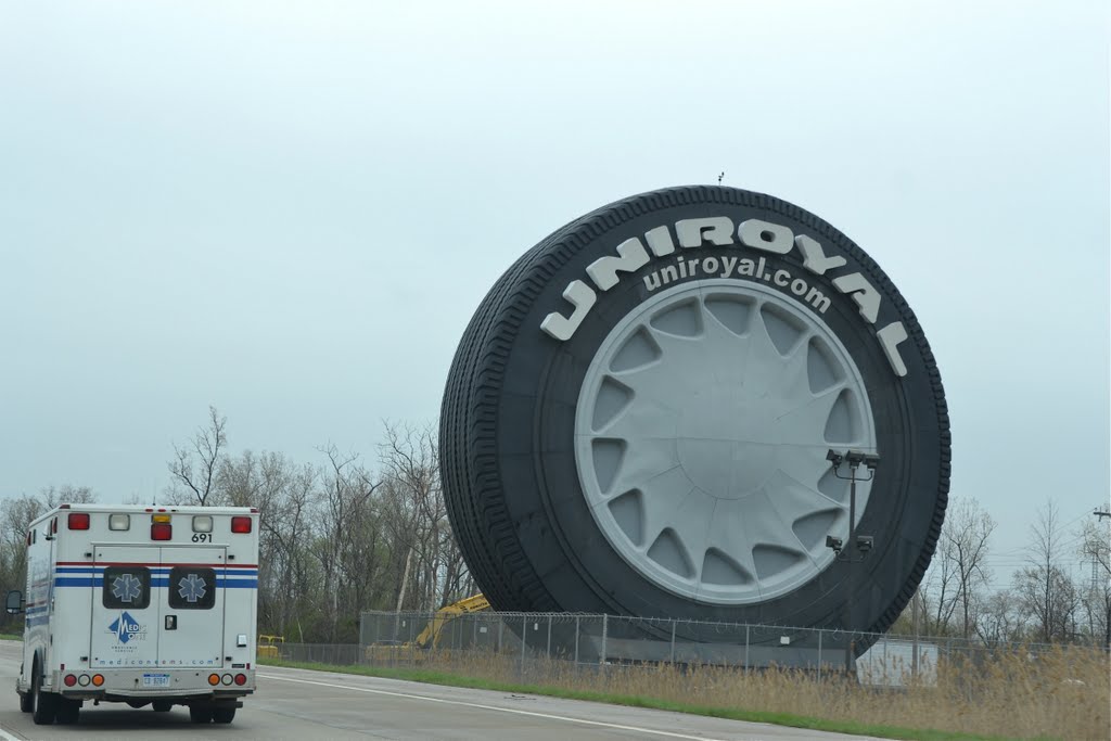 Big Uniroyal Tire by Buddy Rogers