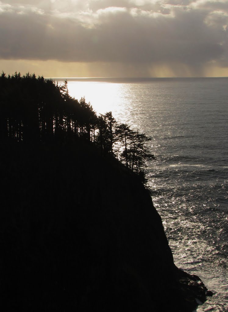 Sunlight, ocean and rain/clouds - Cape Meares, OR, USA. by André Bonacin