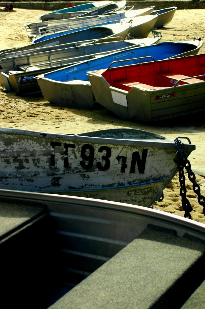 Boats on cogee beach by Donald Kwak