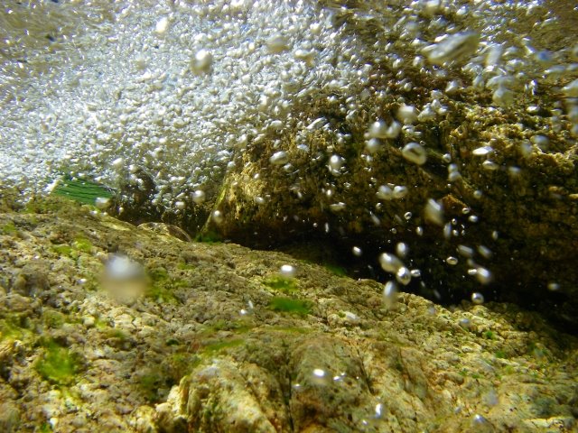 Corse - Fiume de Solenzara - air bubbles under a small waterfall by Michael Eckrich-Neub…