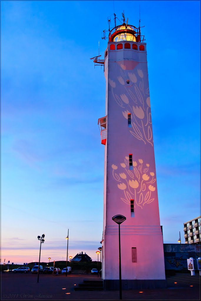 Tulips projected on lighthouse of Noordwijk aan Zee, The Netherlands by Wim Janssen