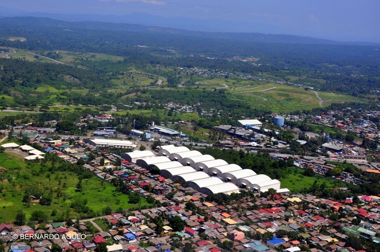 Taking Off, Warehouses near runway, Davao International Airport, Davao City, Philippines by Silverhead