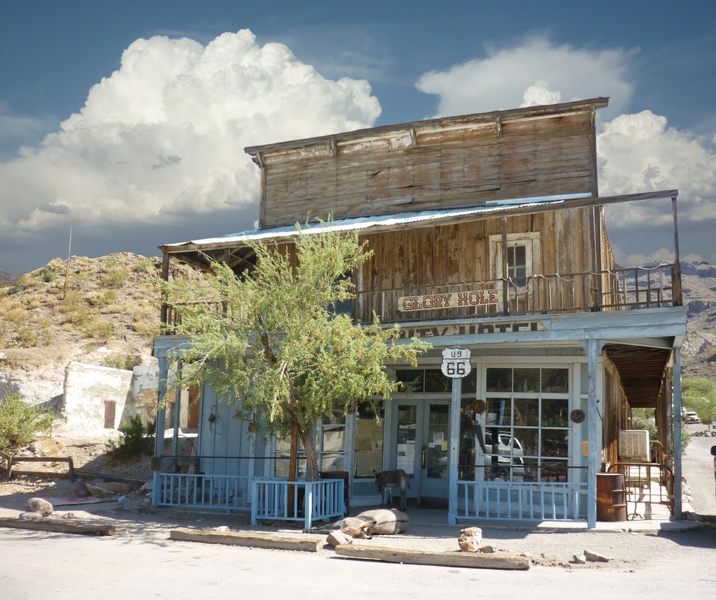 The famous Glory Hole of Oatman, a movie star (How the West Was Won), now looking like a flophouse for burros. by Bill Cook