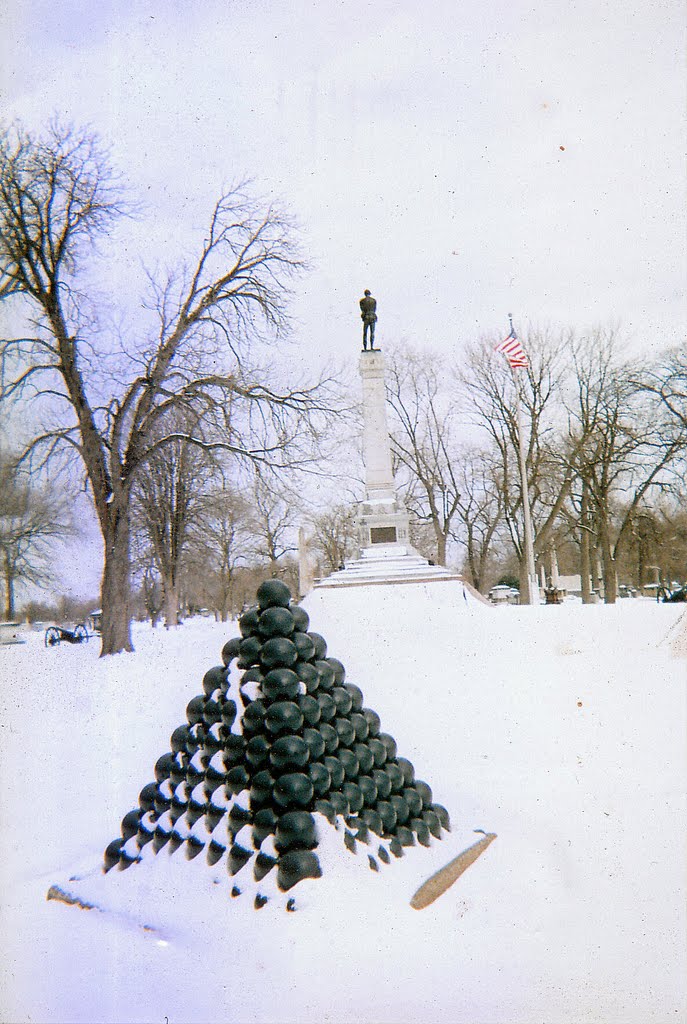 Tetrahedron of cannonballs sits in the snow at the Confederate Mound in Oak Woods Cemetery, a monument to the Confederate prisoners-of-war who died there at Camp Douglas nearly 150 years before, now stunningly incongruous in modern Chicago, 2-7-11 by tompope2001