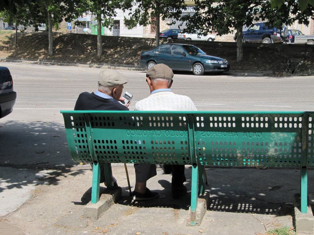 Grandpas listen to football game in Tardajos by caminka