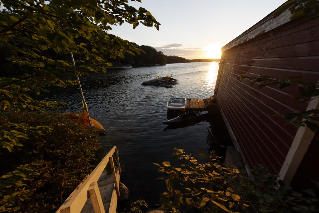 Sunrise behind the boat house by tkreck