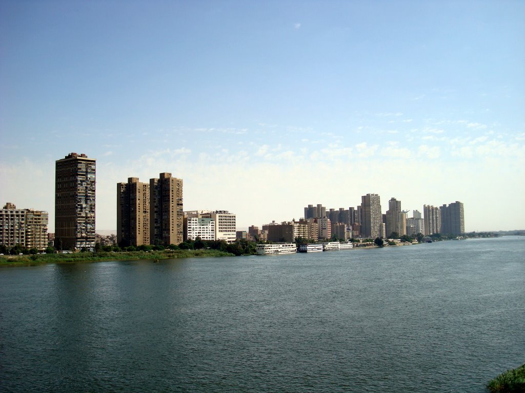 Corniche Al-Nile Dar Al-Salam at noon,from Mounib bridge, Giza by Alaeddin Faruki