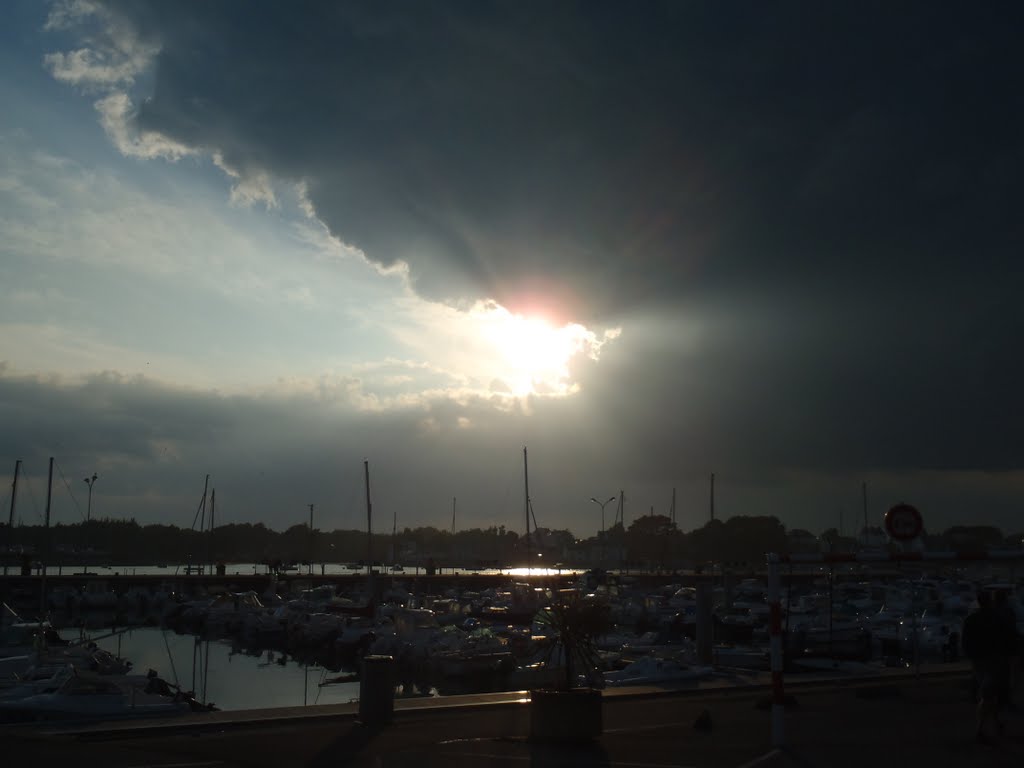 Evening sun and dark clouds over the port of Etel by michiel.vanderwulp