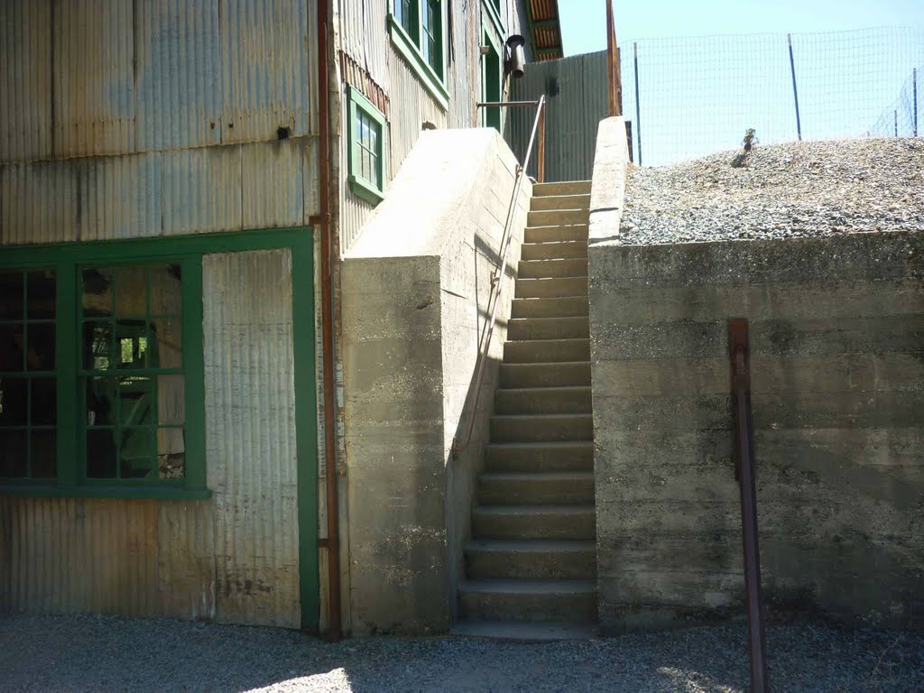 Stairs to the electrical shop. The work in the mine, it don’t stop. When steam ran the scene they wacked the forest down clean, so using juice restored the hilltop. by Bill Cook