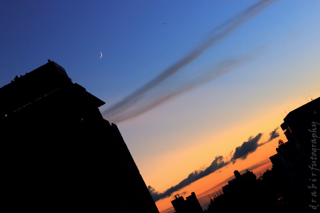 The moon on the day of Eid. It was one of the finest sunsets of 2011. Unfortunately I got to the roof a tad late and missed most of it. Eid Mubarak everyone. Hope you had a wonderful one. by drabir