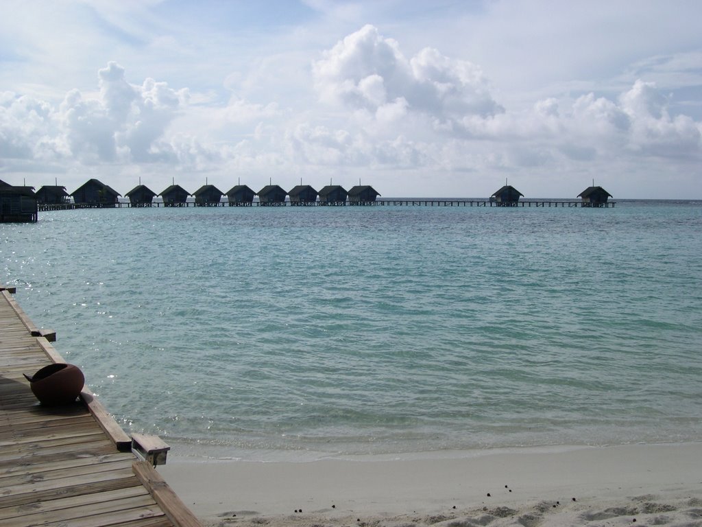 White sand resort water bungalow by Raymond Chau