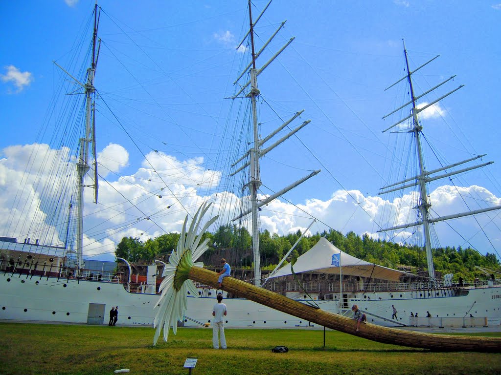 Museum ship Suomen Joutsen behind a giant flower by Petteri Kantokari