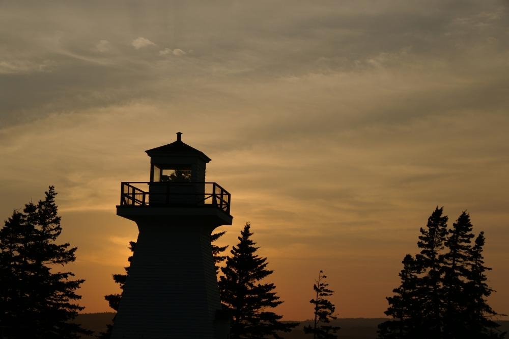 Lighthouse at dusk, Five Islands PP. by Peter Staub