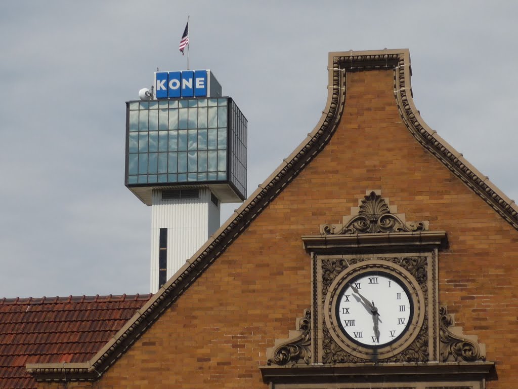 Train station with Kone Elevator in background by embryojoe