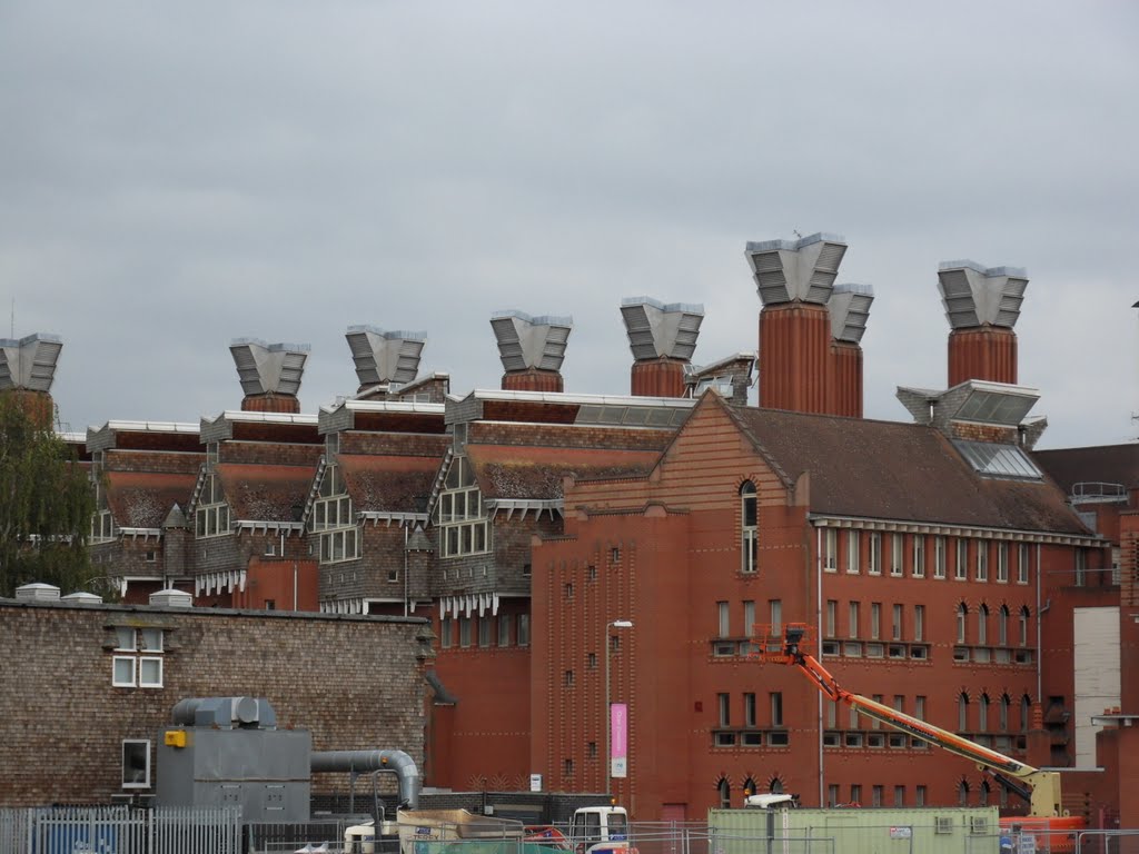 I think beautiful, the rising ventilation systems fron the red brick and shigle University Building by Bobsky.