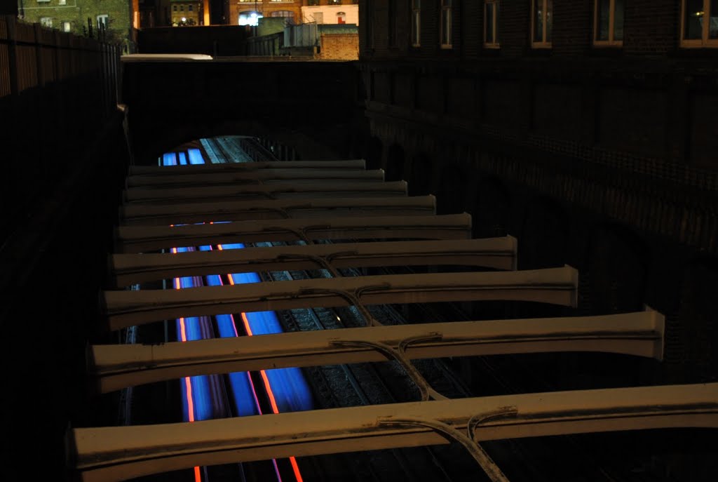 Crosspieces above tracks holding walls of tunnel open section (taken near King's Cross) by Alexander Kachkaev