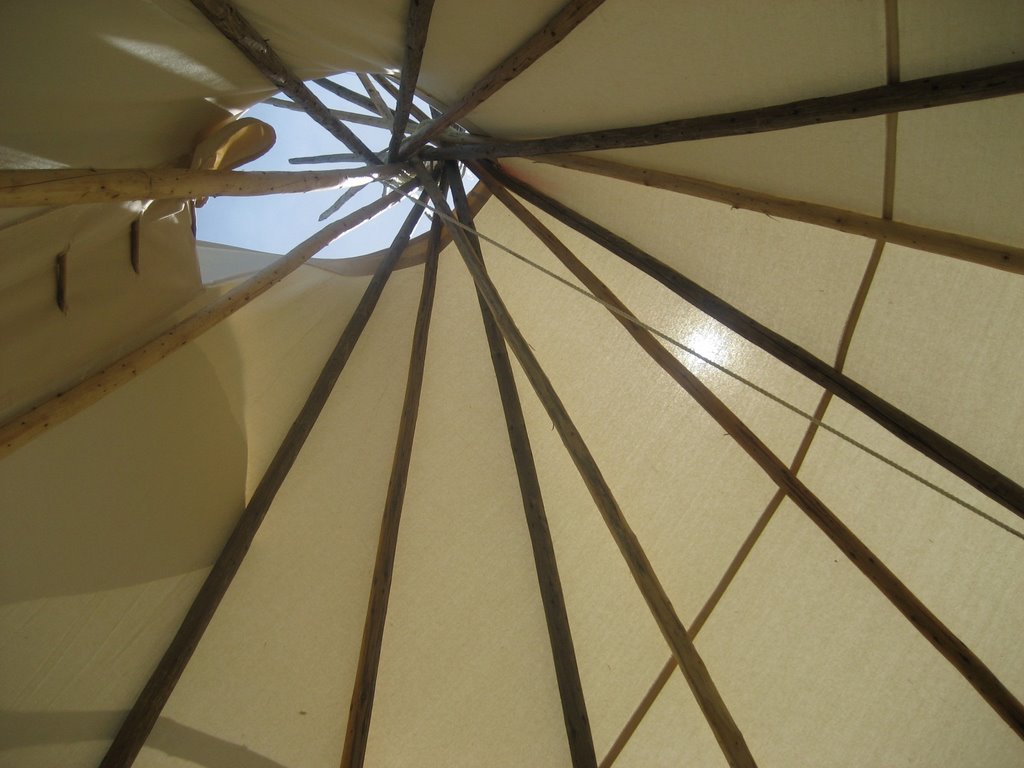 Looking skyward inside a First Nations Tent by Will C. van den Hoon…