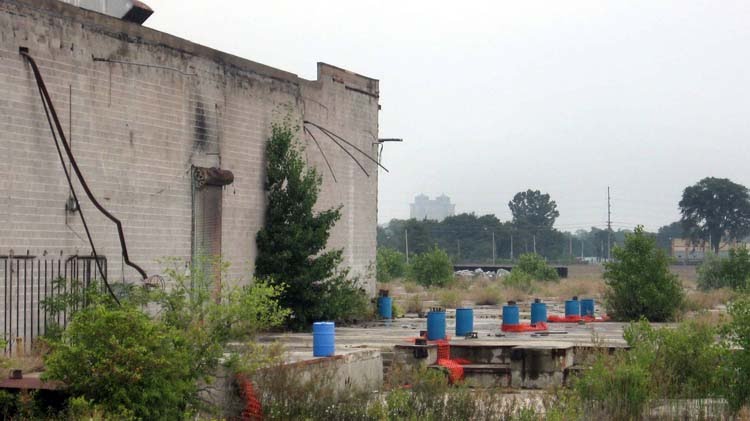 Clark Equipment's ruins, with the Sanitarium in the distance by nailhed.com