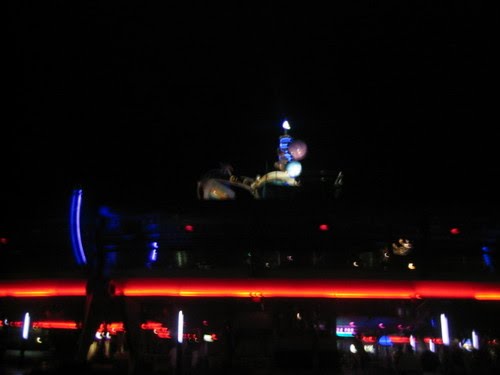 Astro Oribiters in Tomorrowland at night by disneypix4life