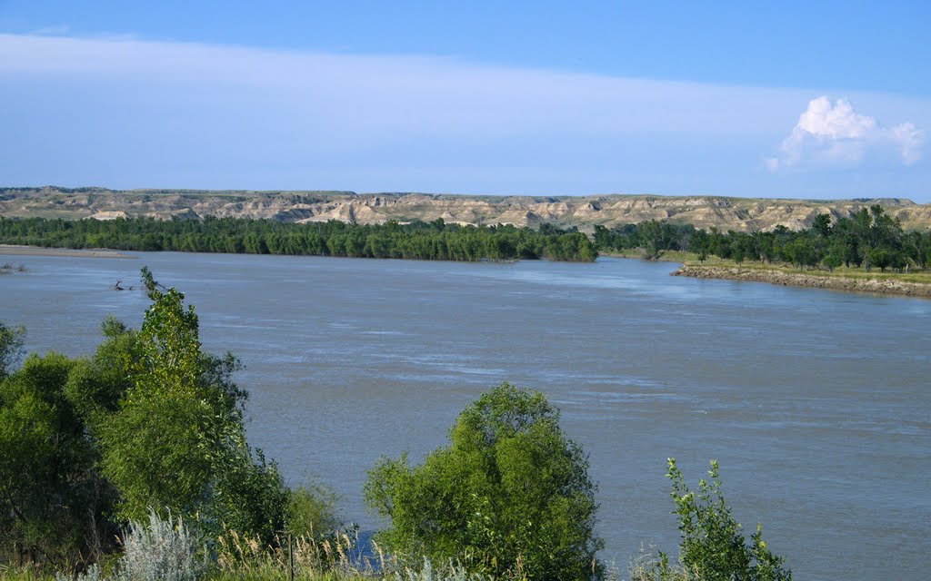 Badlands Across the Swolen Missouri River, Richland, Montana by © Tom Cooper