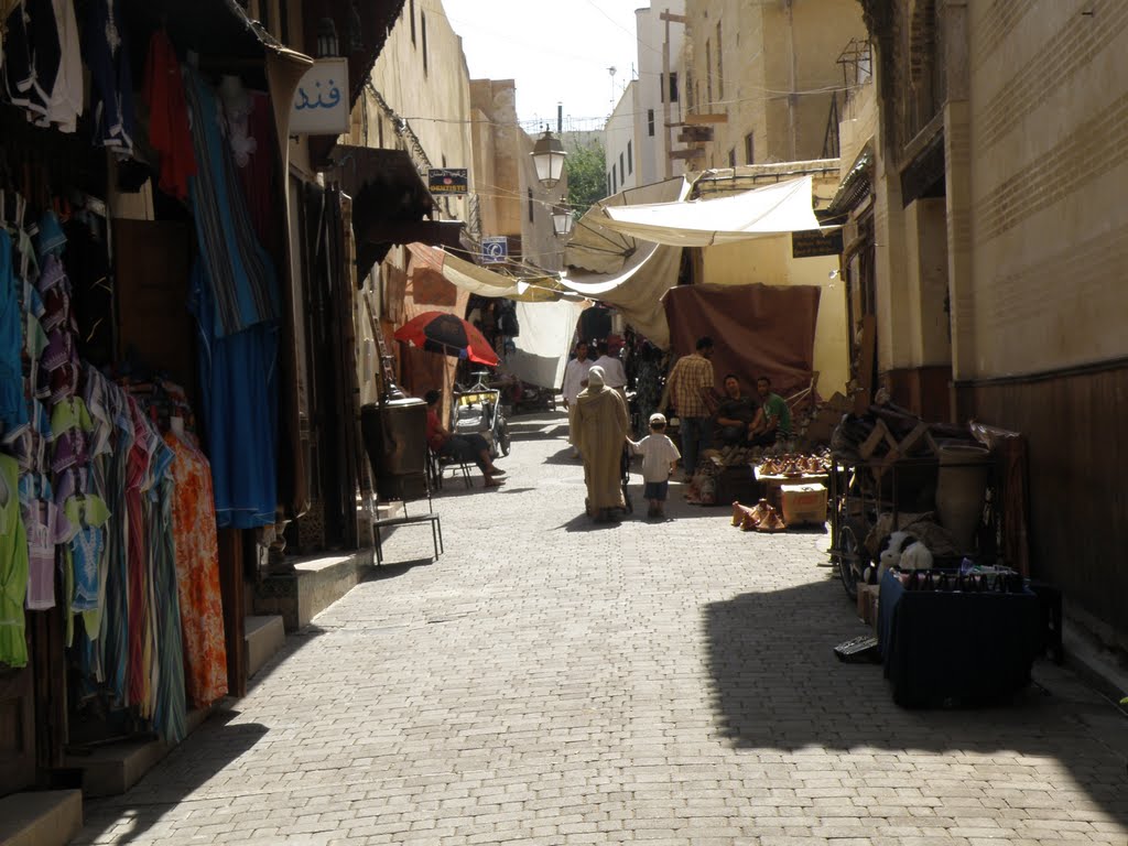 Bazaar in the narrow streets by DM brothers