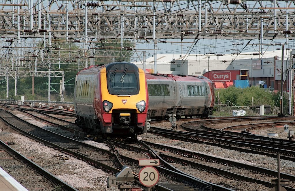 A 'Virgin Voyager' leaves Crewe for Manchester, April 30, 2011. by melvilla1903