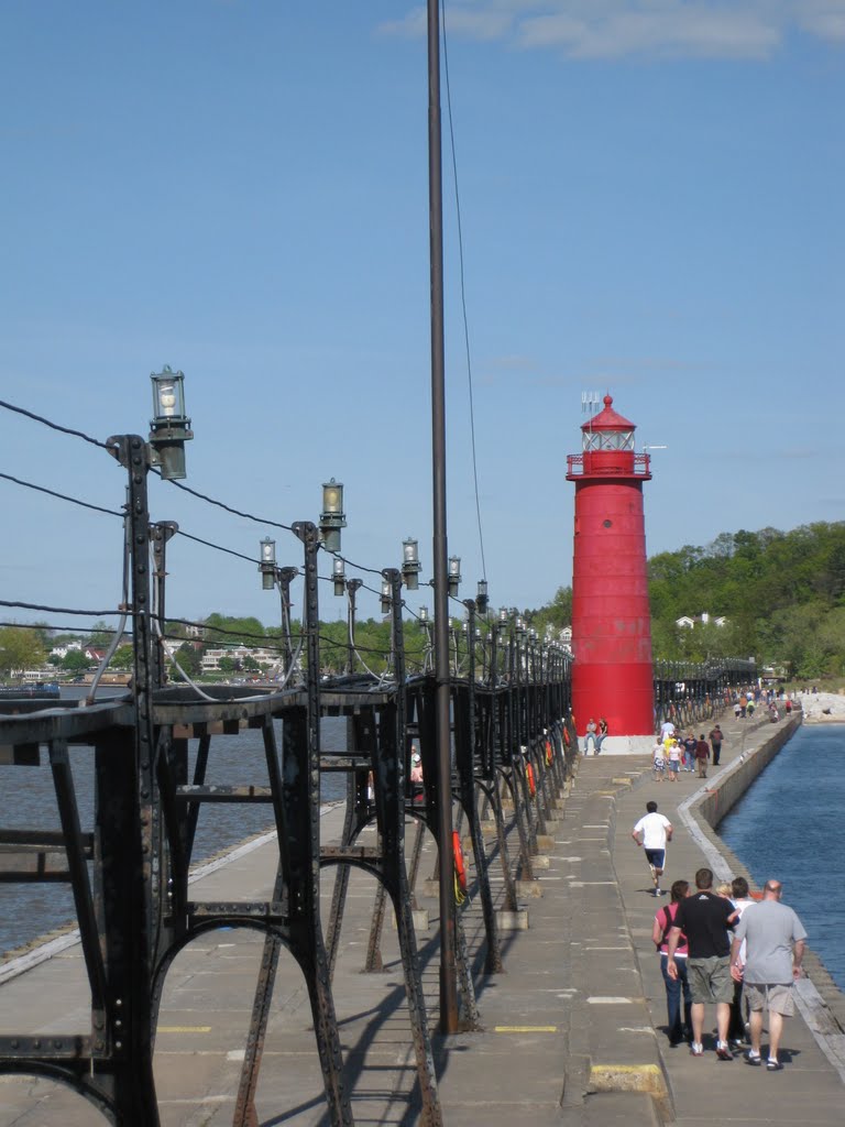 Lines of light bulbs on the catwalk of Grand Haven south pier by UnagiUnagi