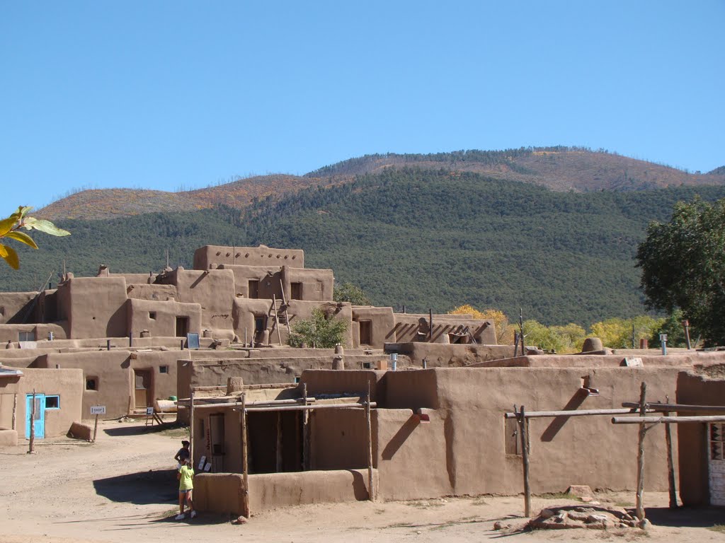 Taos Pueblo looking to the hills by John Hains