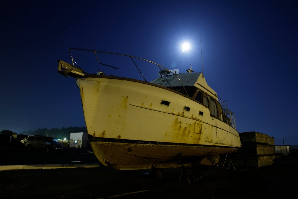 Boat parked @ Crescent City Harbor, CA under moon light by Bun Lee