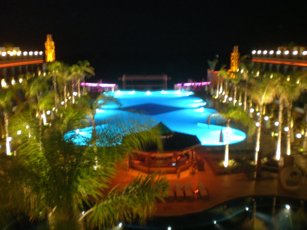 Hotel Cratos Premium, swimming pool by night by Pawel Peska