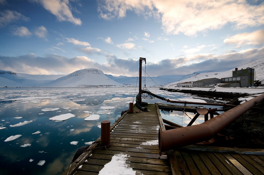 Calm sea, clouds and ice by oddurjons